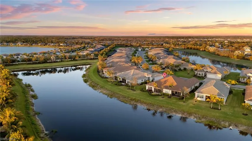 Drone / aerial view with a water view and a residential view
