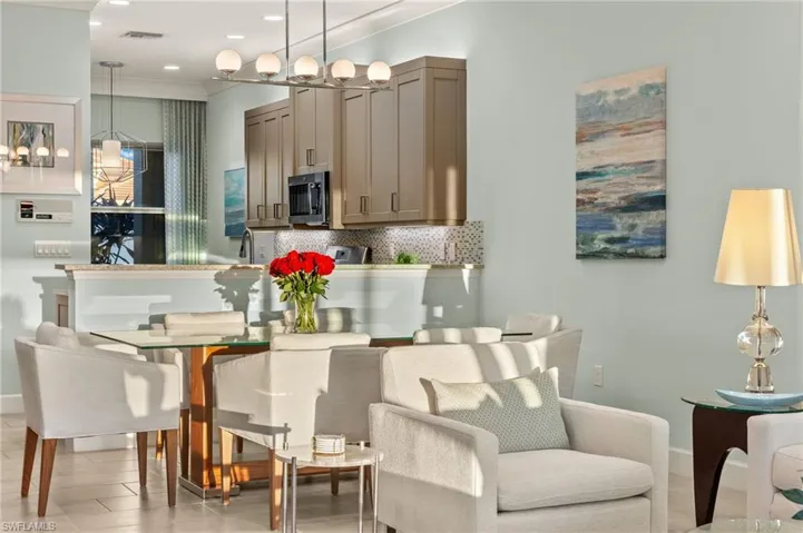 Dining room with ornamental molding, recessed lighting, visible vents, and baseboards