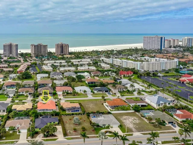 Aerial view with a beach view and a water view