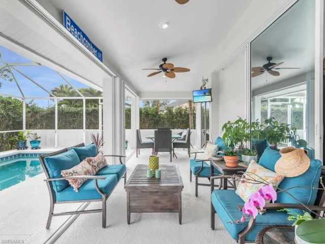 Sunroom / solarium with ceiling fan and a wealth of natural light