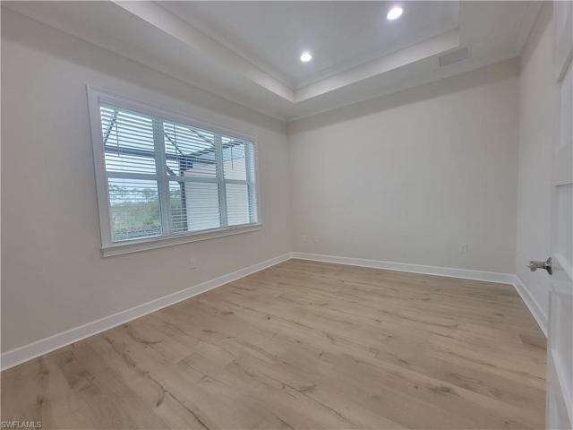 master bedroom overlooking pool and preserve area