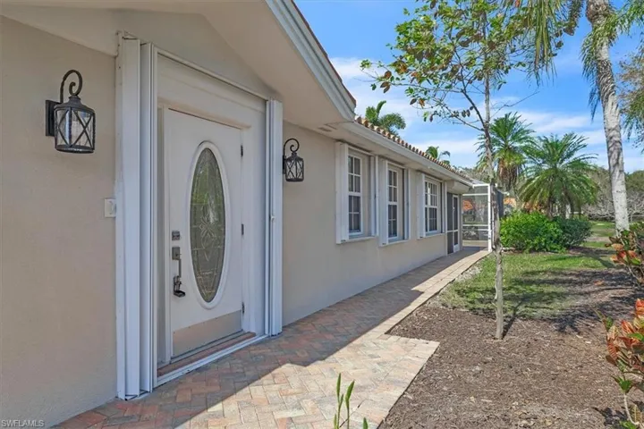 Wide, pie shaped lot with attractive landscaping.