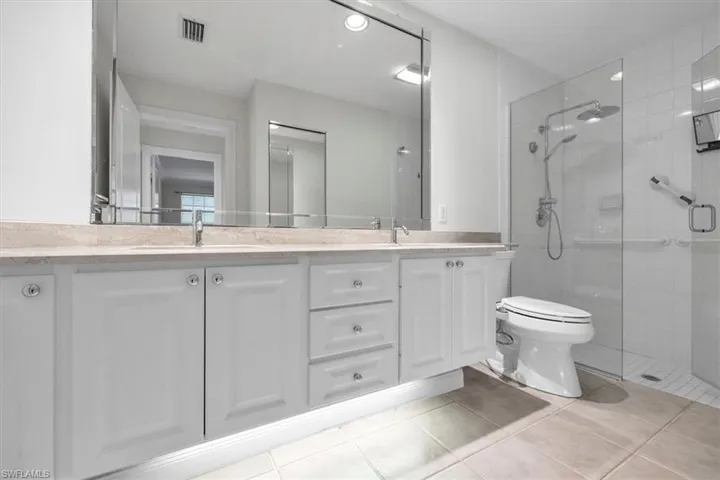 Master bathroom with dual sinks and shower.