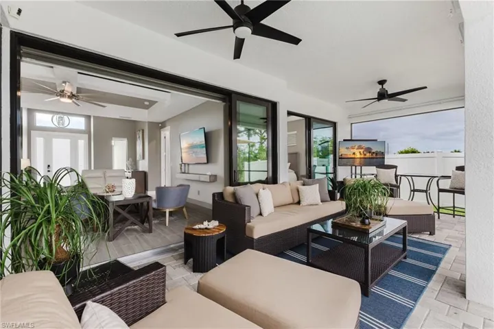 View of patio featuring an outdoor hangout area and a ceiling fan