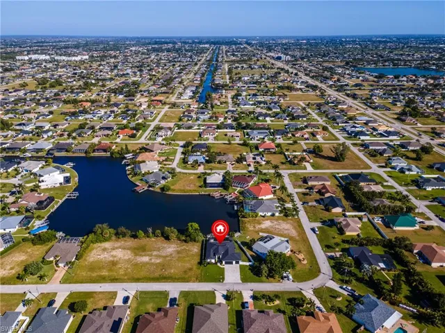 Aerial overview of property's location with nearby suburban area