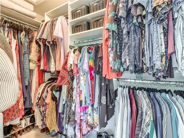Spacious closet with carpet floors