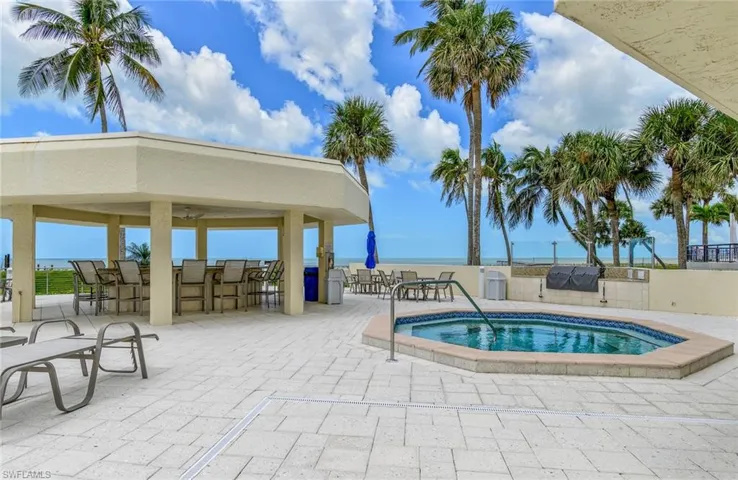 Cabana on pool deck wit hot tub