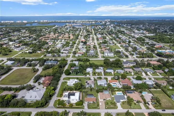 Aerial overview of property's location featuring nearby suburban area and a nearby body of water