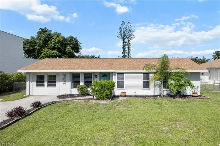 Single story home with roof with shingles
