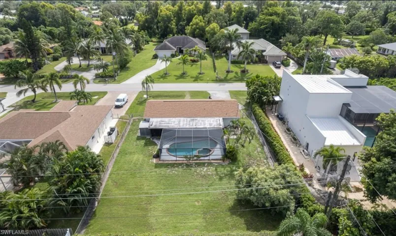 Aerial view of residential area with a pool area