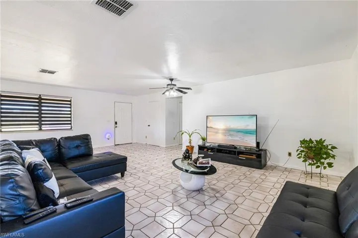 Tiled living room with ceiling fan