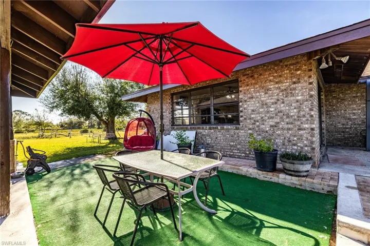 View of patio featuring outdoor dining area