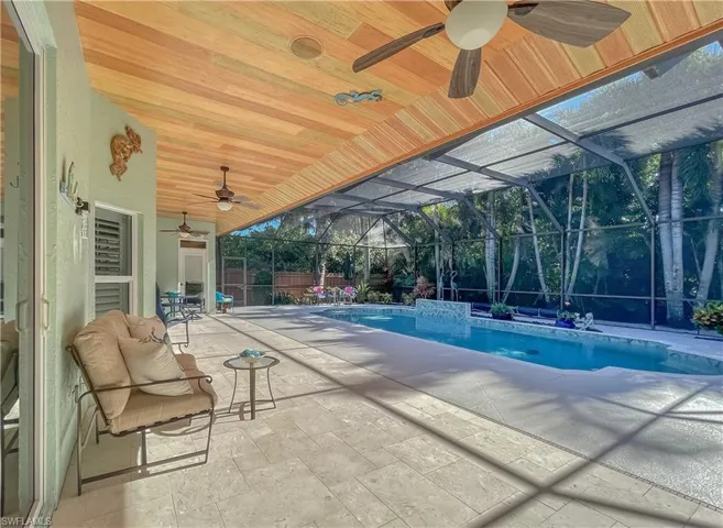 Expansive (41 feet) of covered lanai offering the Perfect area for entertaining family and friends as well as corn hole out of the rain!
