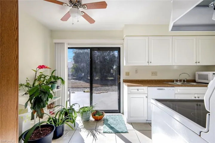 Unit #1 Kitchen and dining area with slider to back patio
