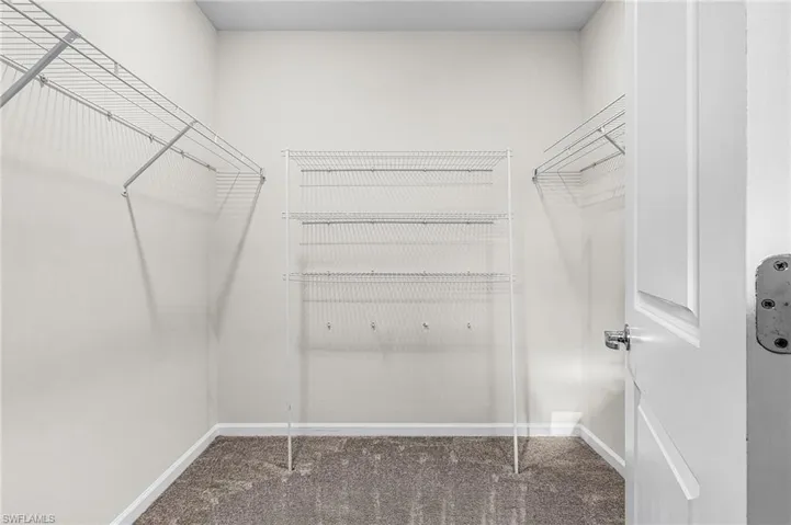 Spacious closet featuring carpet floors in Primary suite