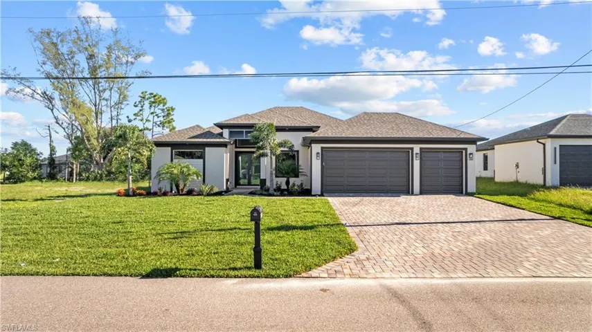 View of front of property with a front lawn