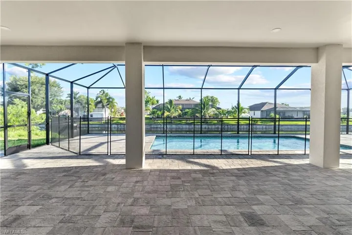 View of pool featuring a patio and a lanai