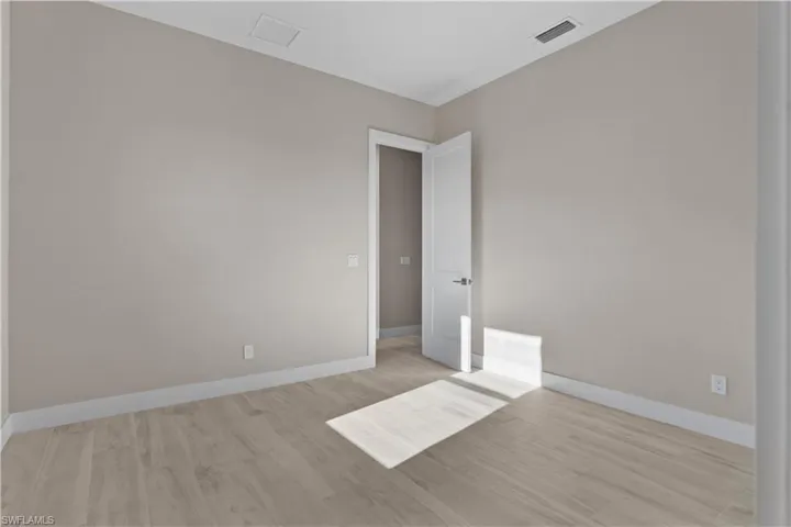 Empty room featuring light hardwood / wood-style flooring
