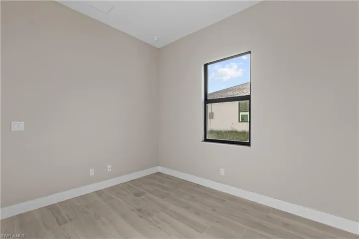 Unfurnished room with light hardwood / wood-style flooring