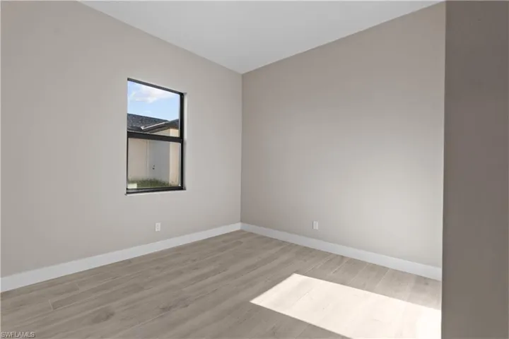 Spare room featuring hardwood / wood-style flooring