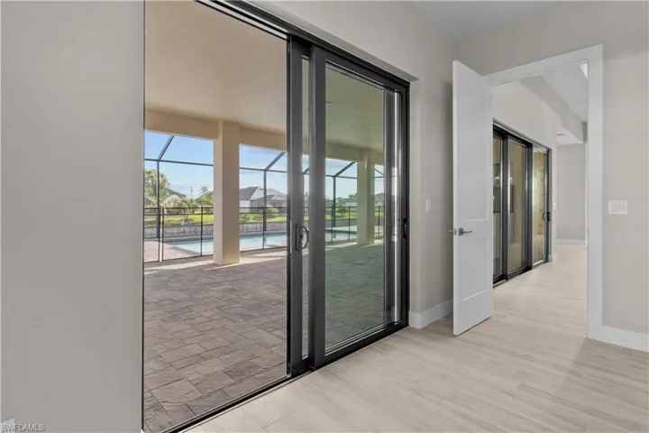 Master bedroom Doorway featuring light hardwood / wood-style flooring and french doors