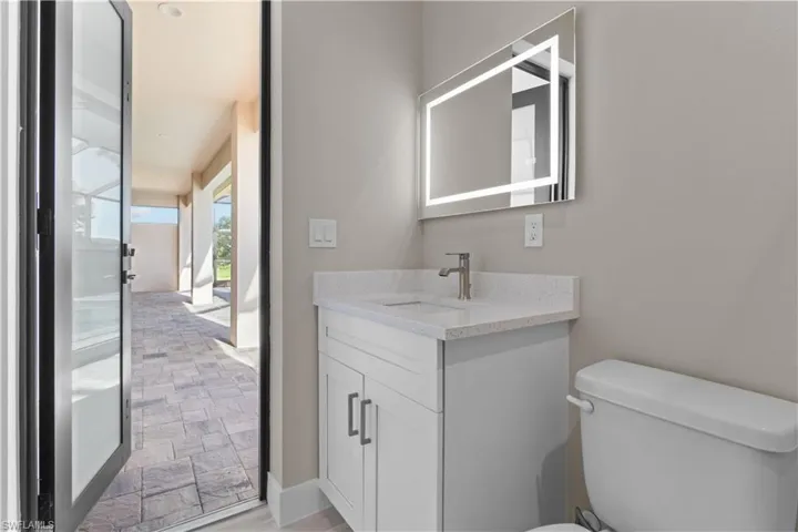Bathroom with vanity and toilet