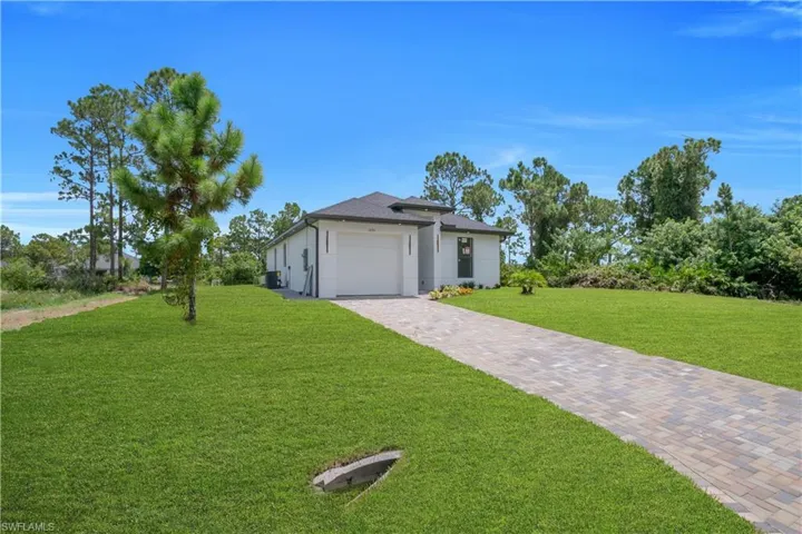 Modern exterior with white siding and dark trim accents