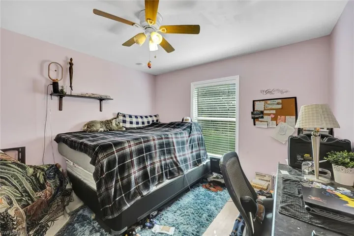 Guest bedroom 2 with updated laminate flooring.