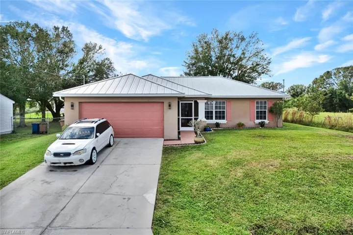 Ranch-style home with 2 car garage and a New Metal Roof 2023