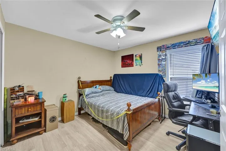 Guest bedroom with updated laminate flooring.