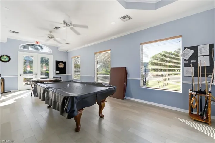 Amenities:Playroom featuring french doors, crown molding, billiards table, ceiling fan, and recessed lighting