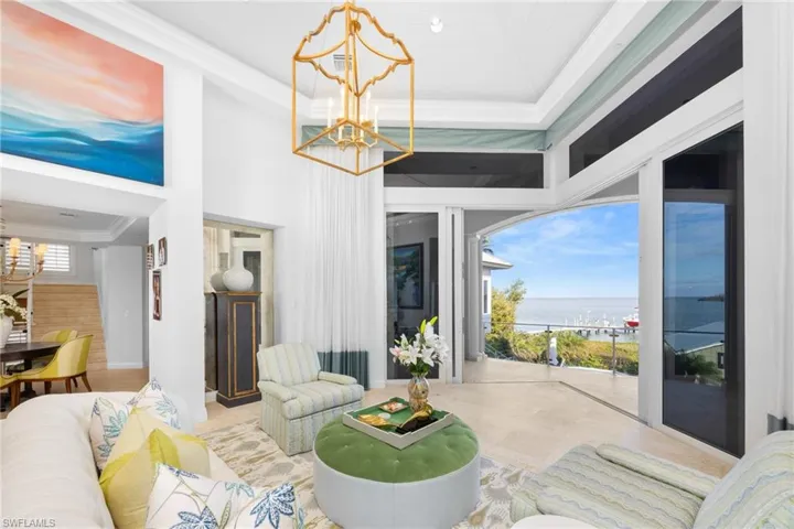 Living room spans the home with pocketing sliders out to the patio & bay views too