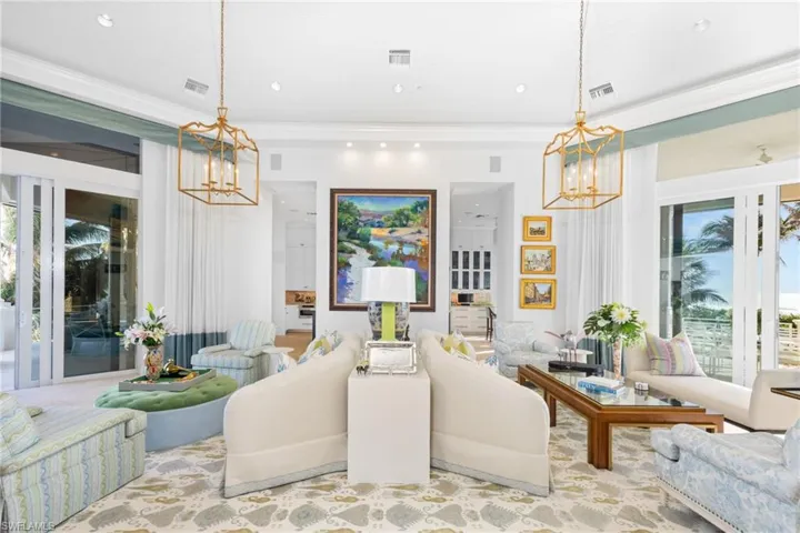 Stunning Living Room with loads of light, island views, custom finishes