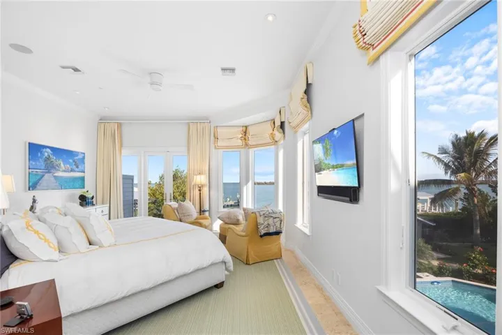 Primary Bedroom is on main living levell (2nd Floor) had remote controlled window treatments & gorgeous Bay views