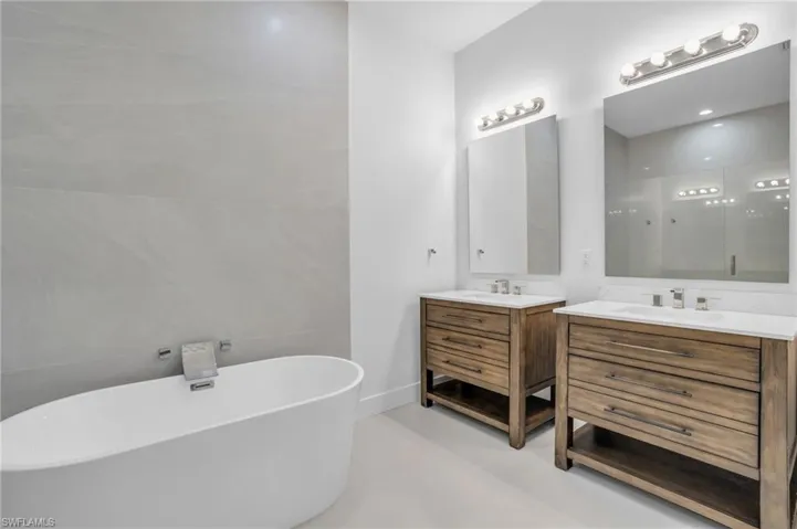 Bathroom with a tub and double sink vanity