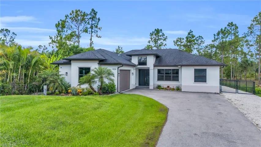 View of front of property featuring a front yard