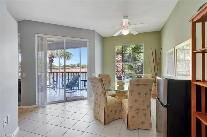 Sunroom featuring a water view, ceiling fan, and lofted ceiling