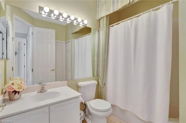 Corridor featuring an upstairs landing, carpet floors, baseboards, and recessed lighting, showing the 3rd bedroom used as a den and the 2nd bath, door to the 2nd bedroom