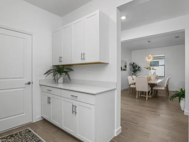 Drop zone with additional after-market cabinetry for extra storage space.