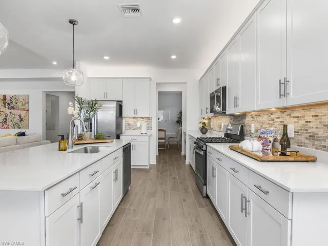 Plenty of cabinet space and storage in this open kitchen.