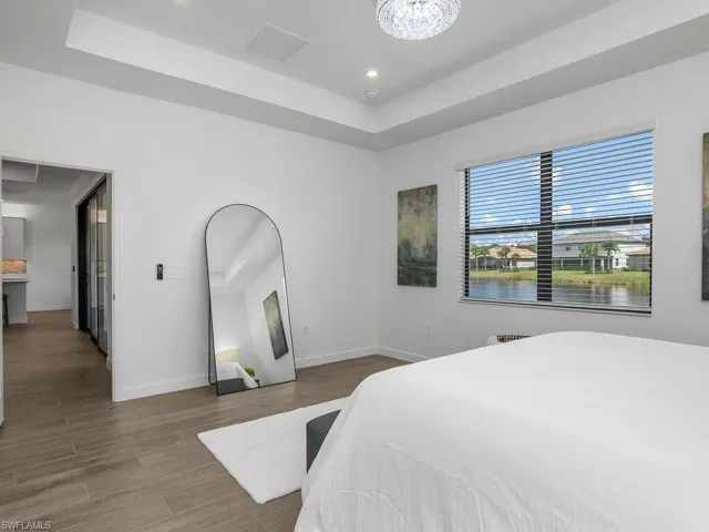 Owner suite with tray ceiling and water view.