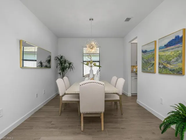 This versatile space can be used as a formal dining area or as a den/office space.