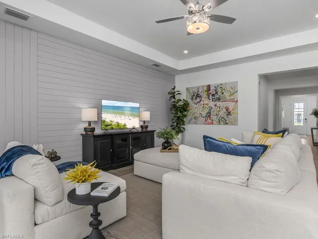 This great room is perfect for gathering with family and friends and offers additional after-market recessed lighting, ceiling fan/chandelier, custom feature wall, lots of natural light, and a FABULOUS view!