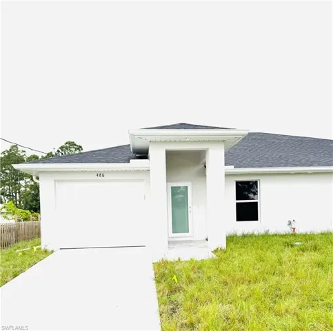 Rear view of property featuring a garage