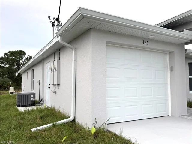 Garage featuring central AC unit