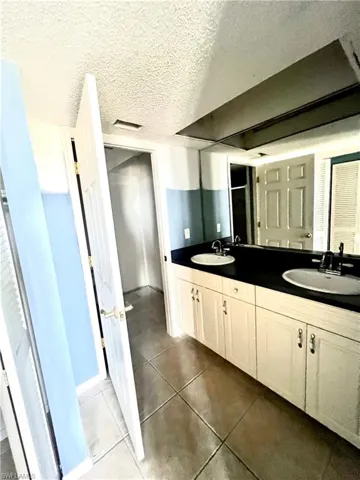 Bathroom featuring dual vanity,