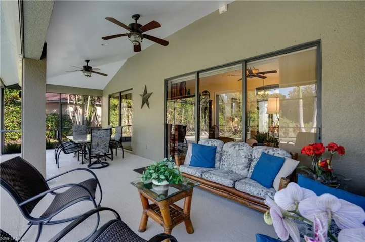View of patio with outdoor lounge area, outdoor dining area, and a ceiling fan