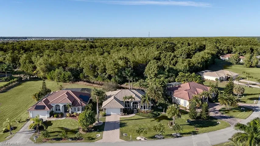 View from above of property with a forest