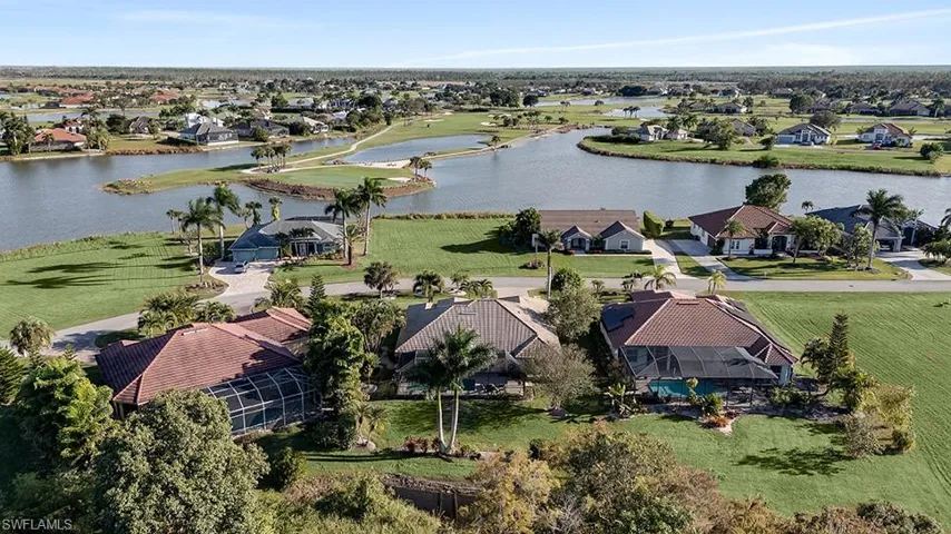 Aerial perspective of suburban area with a large body of water