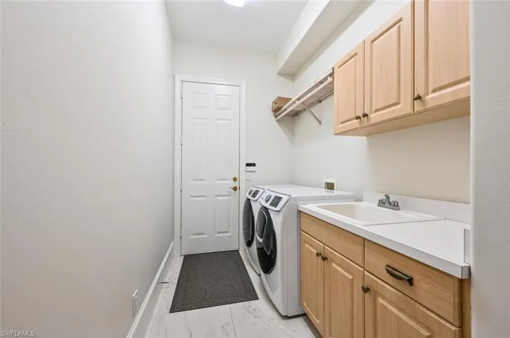 In House Laundry with Tub sink and access to the garage